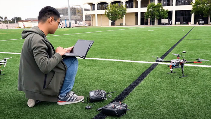 A computer engineering student pilots an autonomous drone