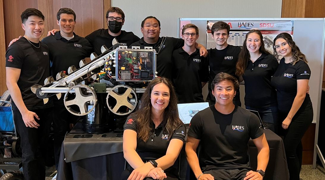 The members of team Hades pose with their lunar mining robot